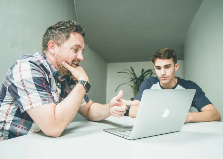 A man having a consultation with another person