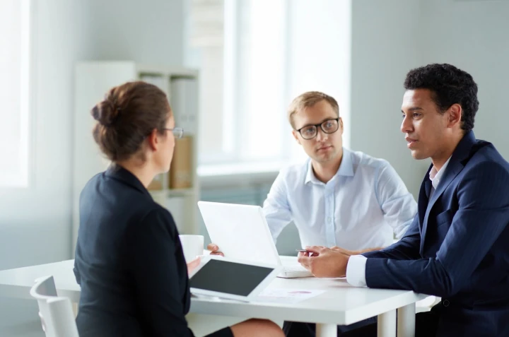 three person having a conversation